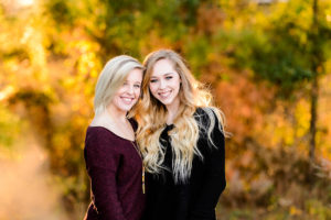 two young senior girls smiling outdoor portrait