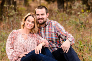 middle georgia engagement photographer session couple in field sunset pictures